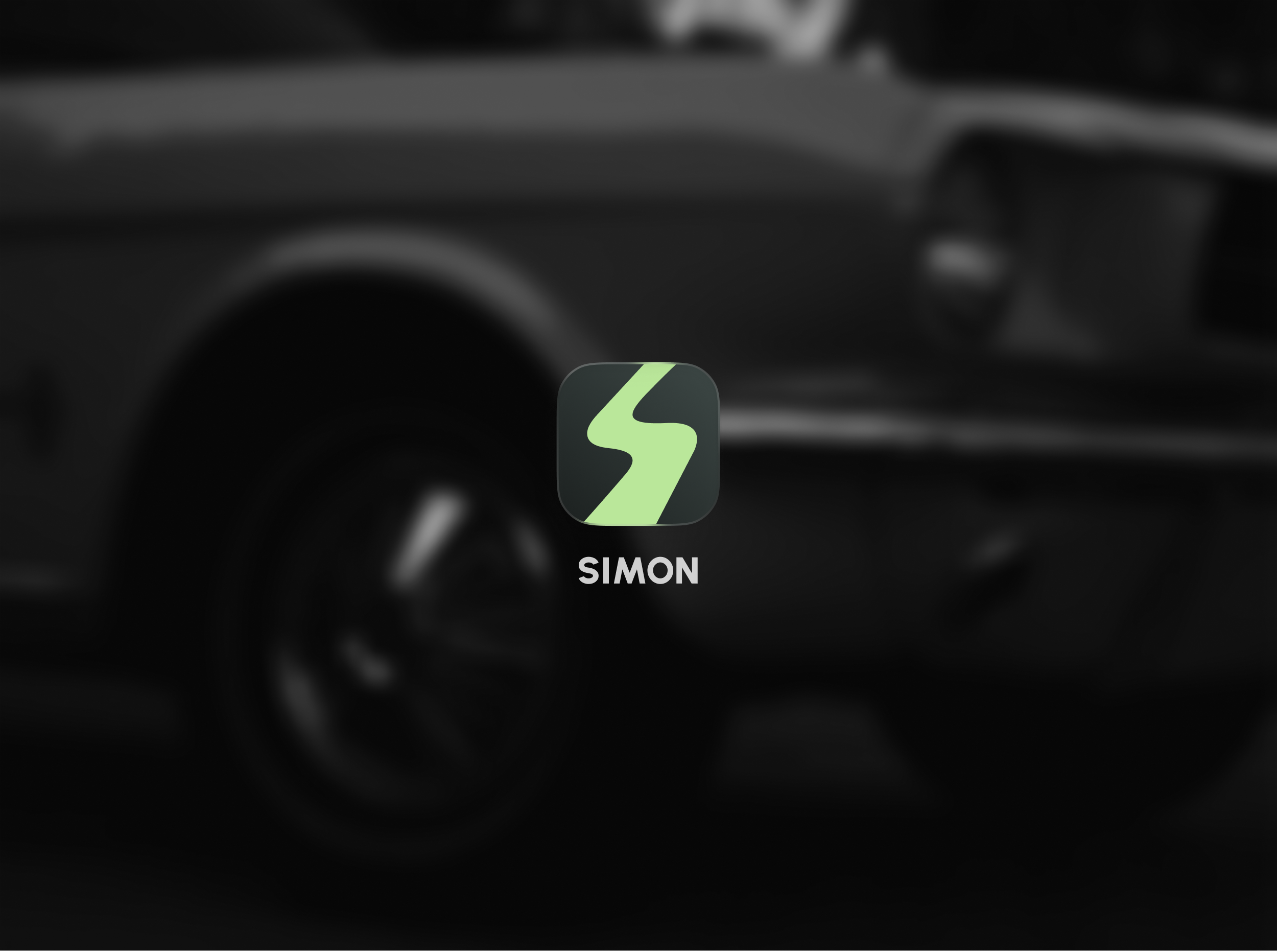 模糊汽车背景中央的 SIMON 品牌标志